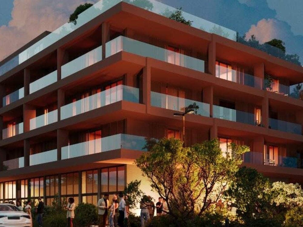 Sun Sea Residence — exterior at dusk, deep balconies and warm interior lighting, Golem.